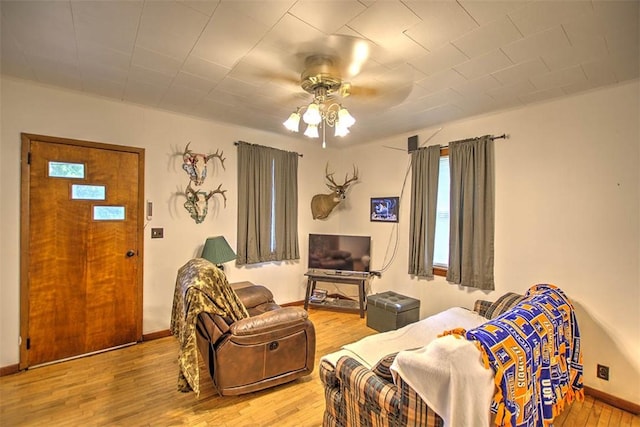 1212 Washington St, Clinton, IL 61727 - living area featuring wood finished floors and ceiling fan