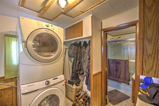 1212 Washington St, Clinton, IL 61727 - laundry room with stacked washer / dryer and wainscoting