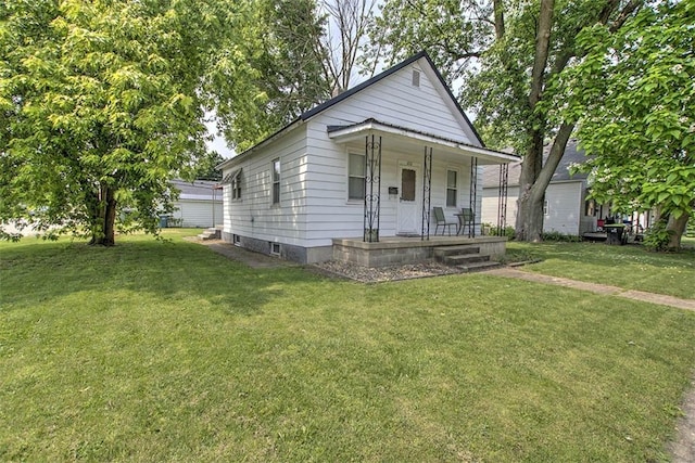 1212 Washington St, Clinton, IL 61727 - view of front of property with a porch and a front lawn