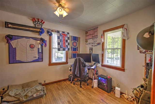 1212 Washington St, Clinton, IL 61727 - home office with hardwood / wood-style floors and a ceiling fan
