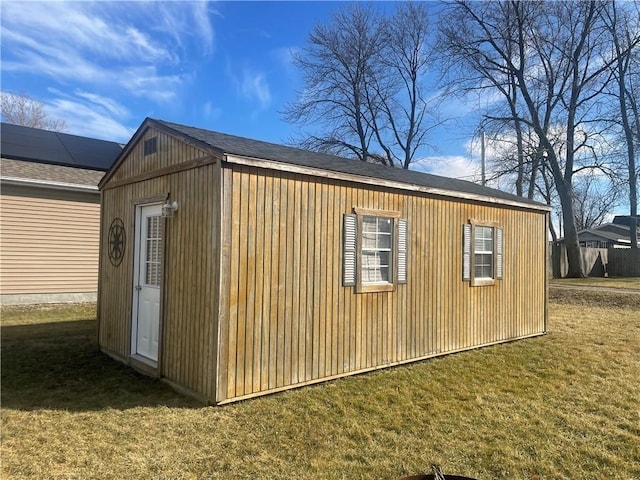 view of outdoor structure with a lawn