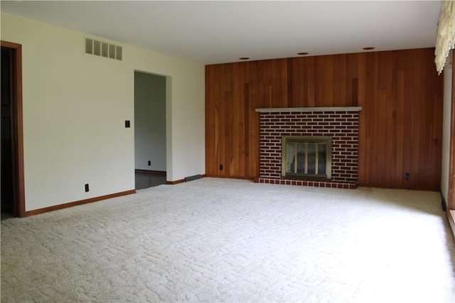1011 W N 3rd St, Shelbyville, IL 62565 - unfurnished living room featuring wooden walls, a glass covered fireplace, carpet flooring, baseboards, and recessed lighting