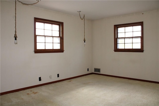 1011 W N 3rd St, Shelbyville, IL 62565 - carpeted empty room featuring healthy amount of natural light and baseboards