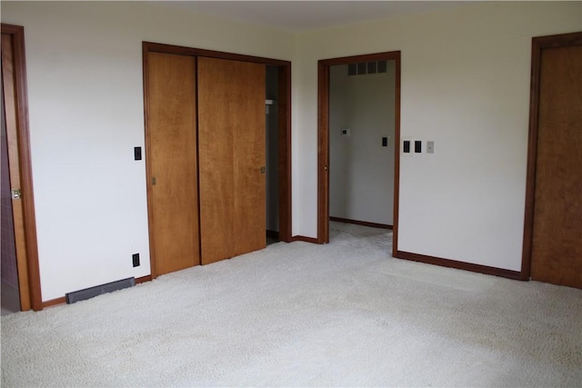 1011 W N 3rd St, Shelbyville, IL 62565 - unfurnished bedroom featuring light colored carpet, a closet, and baseboards