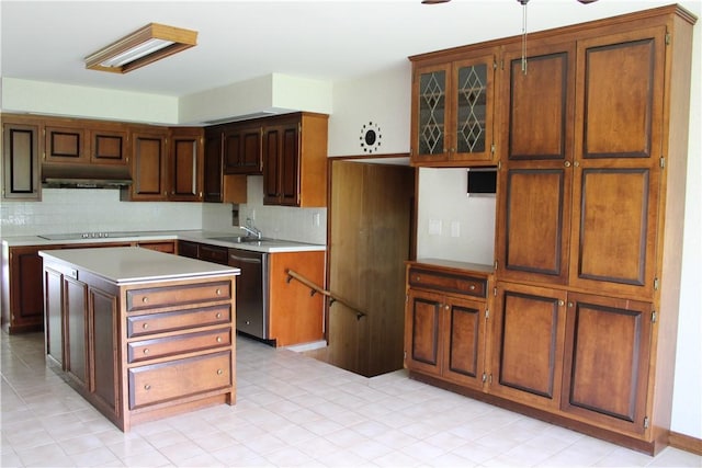 1011 W N 3rd St, Shelbyville, IL 62565 - kitchen featuring under cabinet range hood, stainless steel dishwasher, tasteful backsplash, light countertops, and a kitchen island