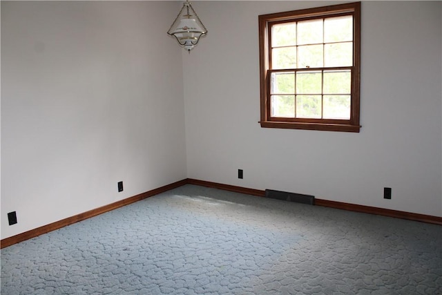 1011 W N 3rd St, Shelbyville, IL 62565 - empty room featuring light colored carpet and baseboards