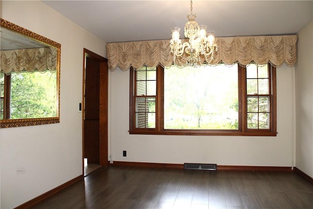 1011 W N 3rd St, Shelbyville, IL 62565 - unfurnished dining area with a chandelier, healthy amount of natural light, and baseboards