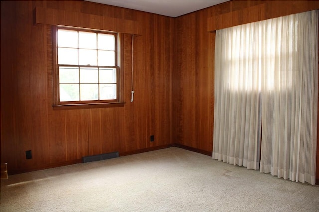 1011 W N 3rd St, Shelbyville, IL 62565 - empty room featuring light carpet, wooden walls, and baseboards