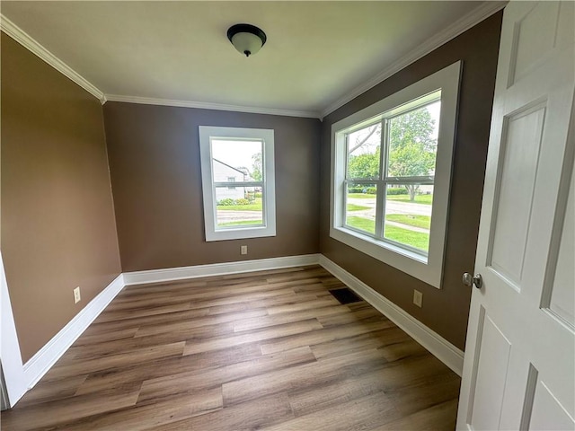 126 E Elliott St, Paris, IL 61944 - spare room with wood finished floors and ornamental molding