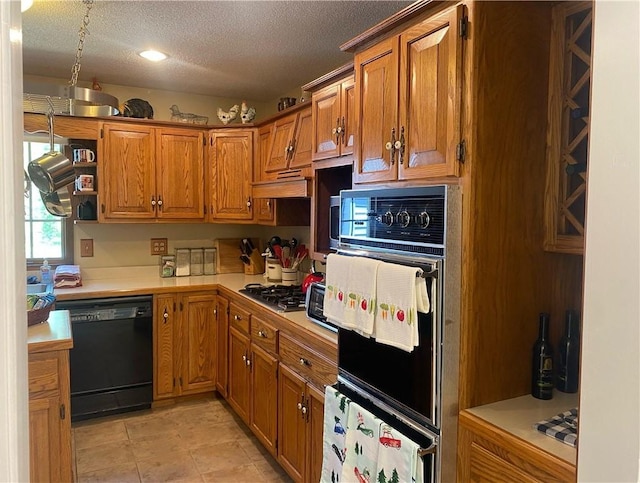 303 S Pine St, Pana, IL 62557 - kitchen featuring black appliances, light countertops, brown cabinets, a textured ceiling, and recessed lighting