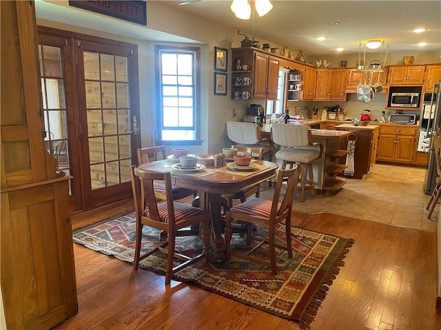 303 S Pine St, Pana, IL 62557 - dining room with light wood-style flooring, recessed lighting, and a ceiling fan