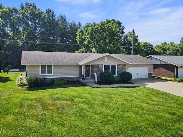 309 Santa Barbara Dr, Effingham, IL 62401 - single story home with stone siding, an attached garage, concrete driveway, and a front yard