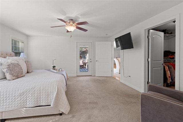 309 Santa Barbara Dr, Effingham, IL 62401 - bedroom featuring multiple windows, a walk in closet, light colored carpet, and access to outside