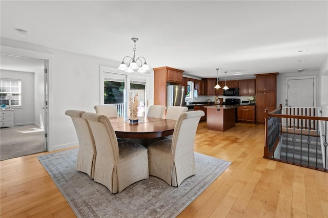 309 Santa Barbara Dr, Effingham, IL 62401 - dining room featuring a chandelier, plenty of natural light, and light wood finished floors