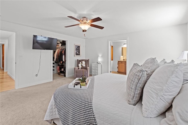 309 Santa Barbara Dr, Effingham, IL 62401 - bedroom featuring light carpet, a spacious closet, a ceiling fan, a closet, and connected bathroom