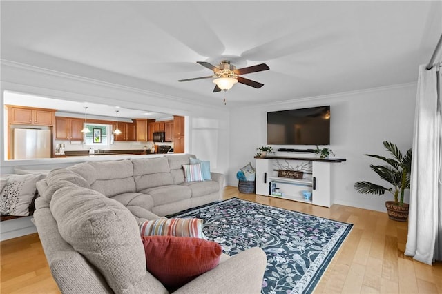 309 Santa Barbara Dr, Effingham, IL 62401 - living room featuring a ceiling fan, light wood-style flooring, and crown molding