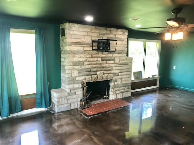 900 W Cumberland Rd, Saint Elmo, IL 62458 - living room featuring healthy amount of natural light, ceiling fan, a stone fireplace, and recessed lighting