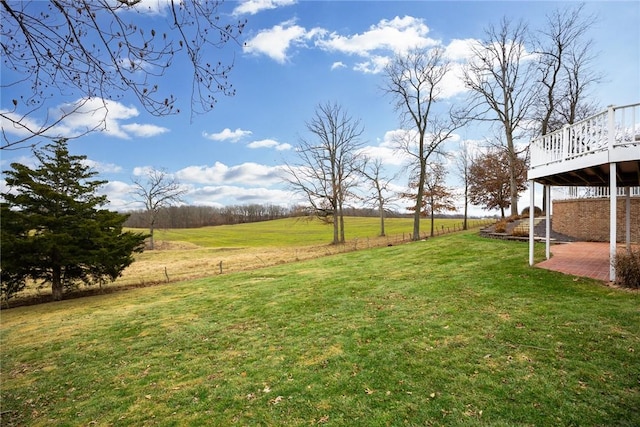 17212 Stonecreek Dr, Effingham, IL 62401 - view of green lawn with a wooden deck, a patio, and a view of rural / pastoral area