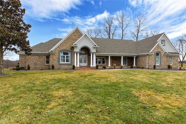 ranch-style home featuring a front yard