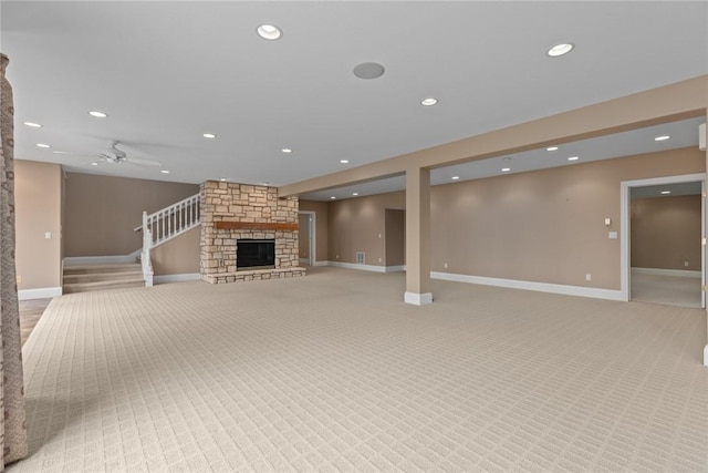 17212 Stonecreek Dr, Effingham, IL 62401 - unfurnished living room with a fireplace, baseboards, recessed lighting, light carpet, and a ceiling fan
