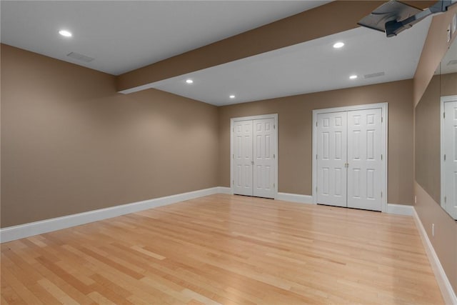 17212 Stonecreek Dr, Effingham, IL 62401 - unfurnished bedroom featuring two closets, light wood finished floors, baseboards, and recessed lighting