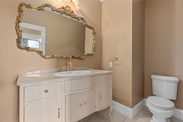 17212 Stonecreek Dr, Effingham, IL 62401 - bathroom featuring vanity, toilet, baseboards, and tile patterned flooring