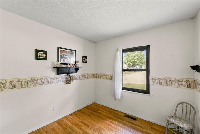2701 E Rd, Danville, IL 61832 - spare room with light wood-style floors and a textured ceiling