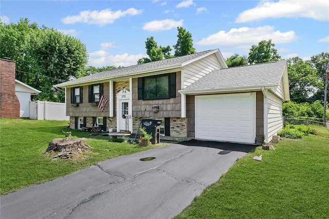 2701 E Rd, Danville, IL 61832 - raised ranch with a garage and asphalt driveway