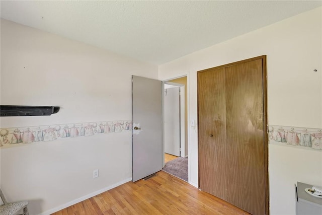 2701 E Rd, Danville, IL 61832 - unfurnished bedroom with light wood-style floors and a closet