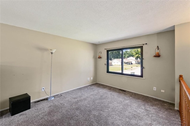 2701 E Rd, Danville, IL 61832 - empty room featuring carpet and a textured ceiling