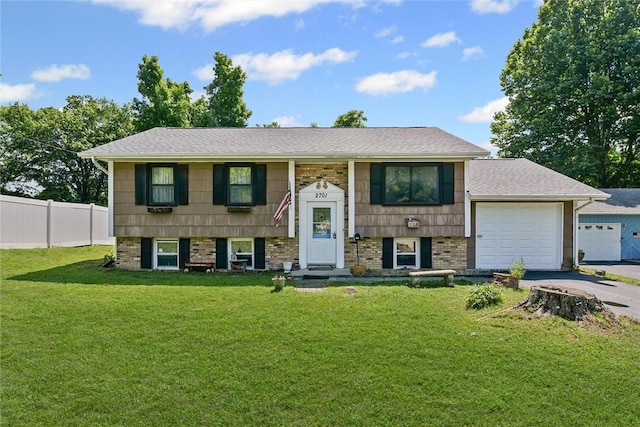 2701 E Rd, Danville, IL 61832 - raised ranch with a garage, asphalt driveway, and brick siding