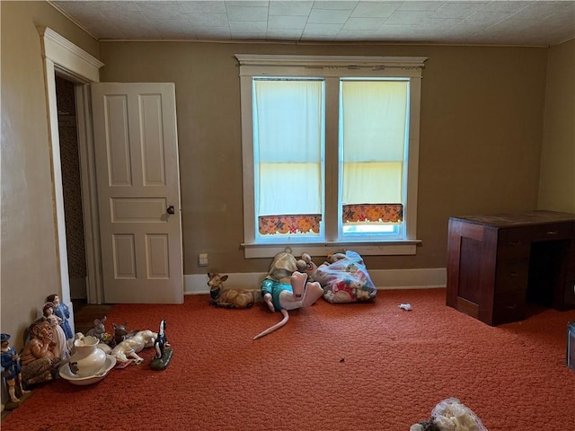 playroom featuring baseboards and carpet