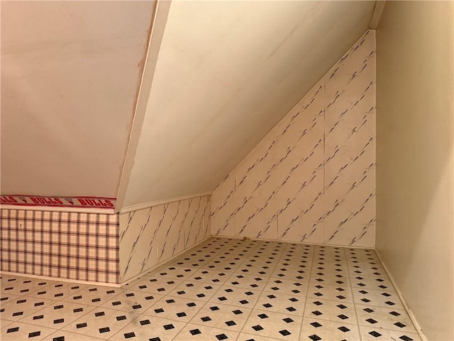 bonus room featuring vaulted ceiling