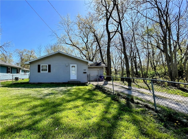 exterior space with a lawn and a garage