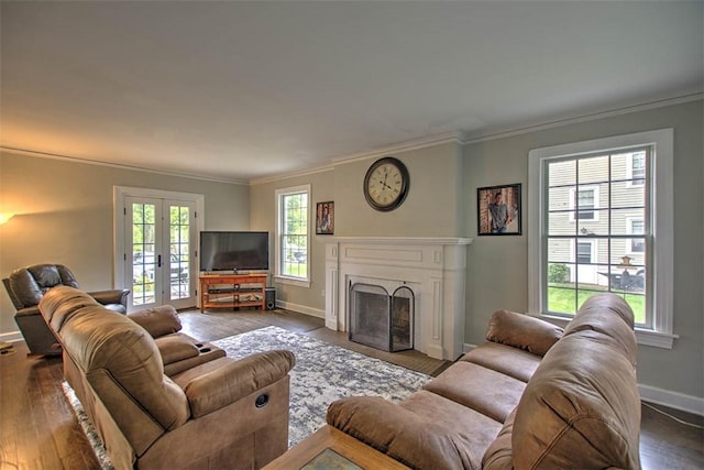 2064 William St, Decatur, IL 62522 - living room with crown molding, baseboards, a fireplace, dark wood-style floors, and french doors