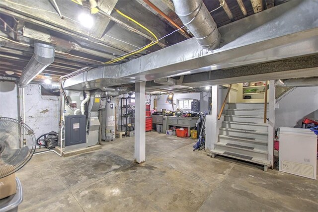 2064 William St, Decatur, IL 62522 - basement featuring water heater, heating unit, and stairway