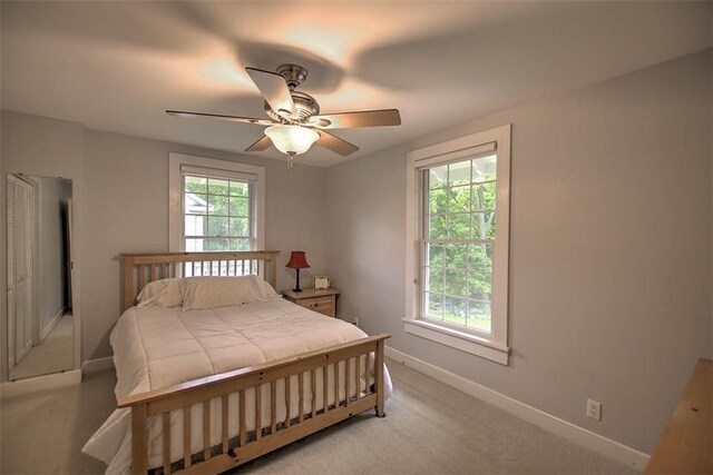2064 William St, Decatur, IL 62522 - bedroom with baseboards, light colored carpet, and a ceiling fan