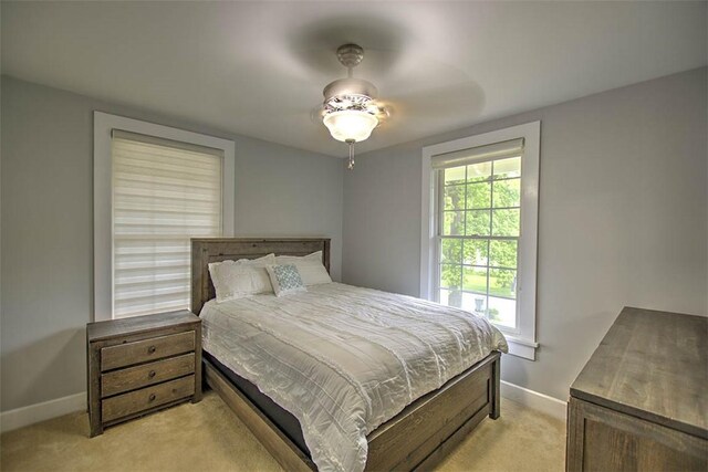 2064 William St, Decatur, IL 62522 - bedroom with light colored carpet, baseboards, and ceiling fan