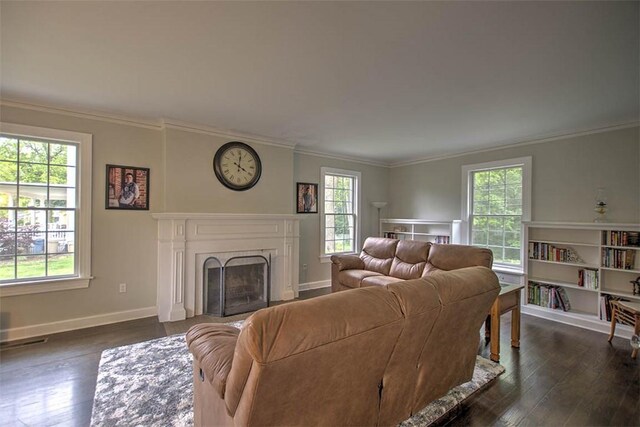 2064 William St, Decatur, IL 62522 - living room with plenty of natural light, dark wood-type flooring, crown molding, and a fireplace