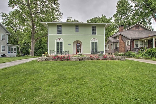 2064 William St, Decatur, IL 62522 - view of front of house with a front lawn, stucco siding, and french doors