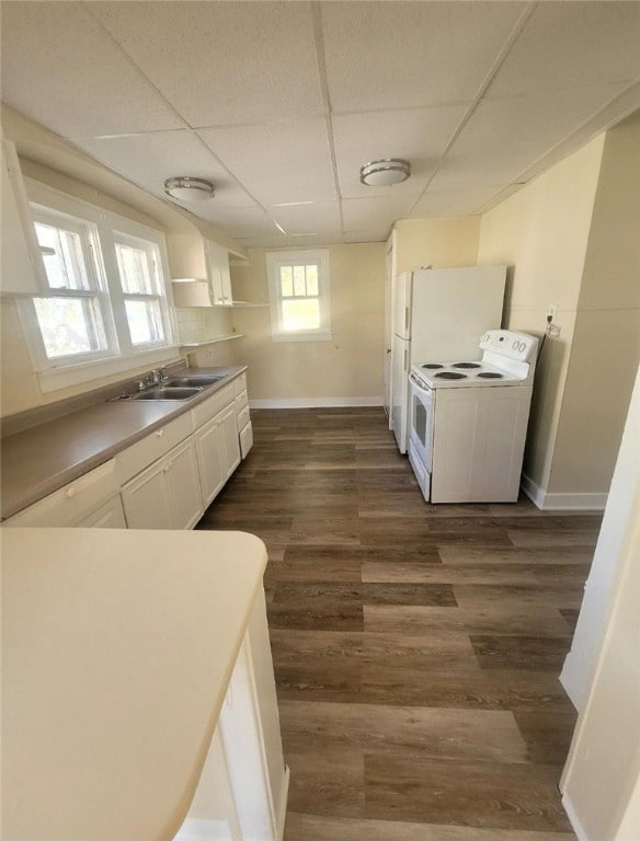 kitchen featuring electric stove, a drop ceiling, white cabinets, and dark hardwood / wood-style floors