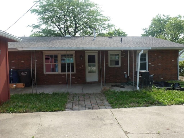 1610 Glenview Ave, Danville, IL 61832 - view of front of home featuring brick siding, a patio area, and roof with shingles