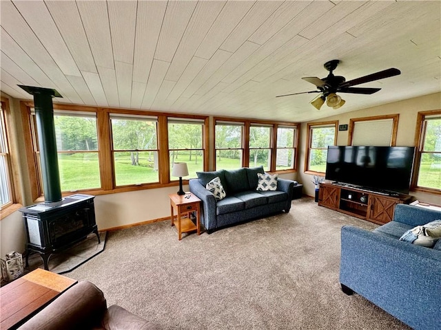 31508 1800 E Rd, Rossville, IL 60963 - carpeted living room featuring a wood stove, a ceiling fan, and lofted ceiling