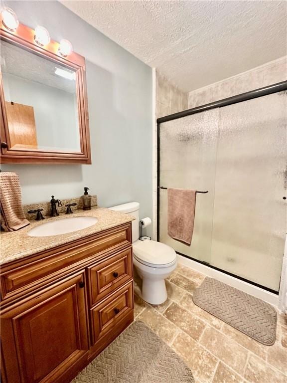 31508 1800 E Rd, Rossville, IL 60963 - full bathroom with vanity, a stall shower, a textured ceiling, and stone finish flooring