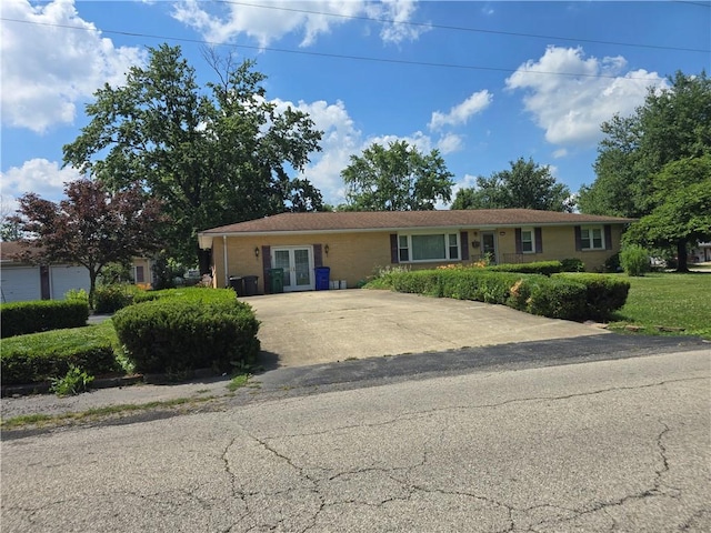3875 E Maynor St, Decatur, IL 62521 - ranch-style house featuring french doors and driveway