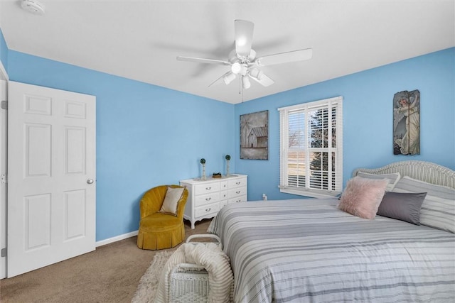 carpeted bedroom featuring a ceiling fan and baseboards