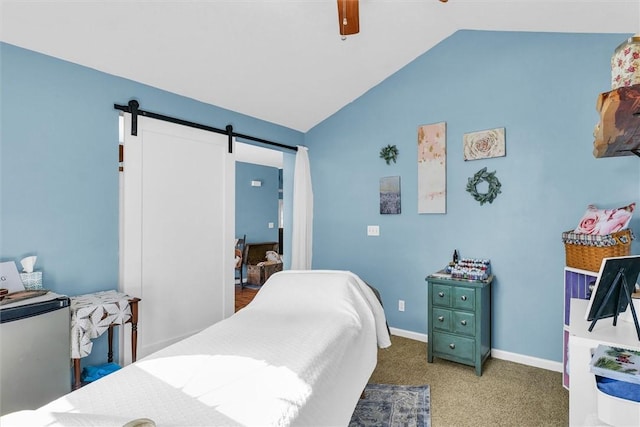 carpeted bedroom with baseboards, lofted ceiling, ceiling fan, a barn door, and stainless steel fridge