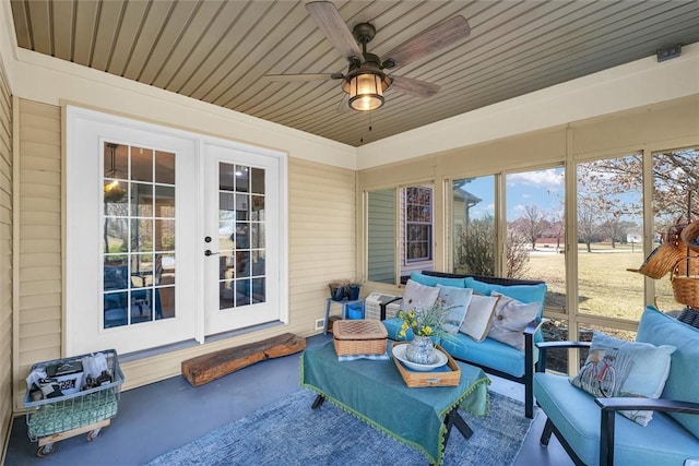 view of patio with an outdoor living space, french doors, and a ceiling fan