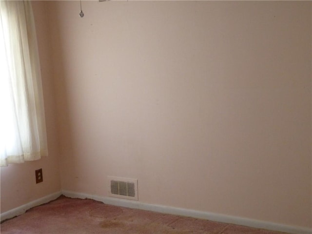 empty room featuring carpet flooring