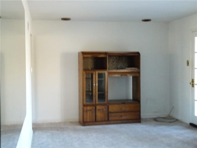 empty room featuring light colored carpet